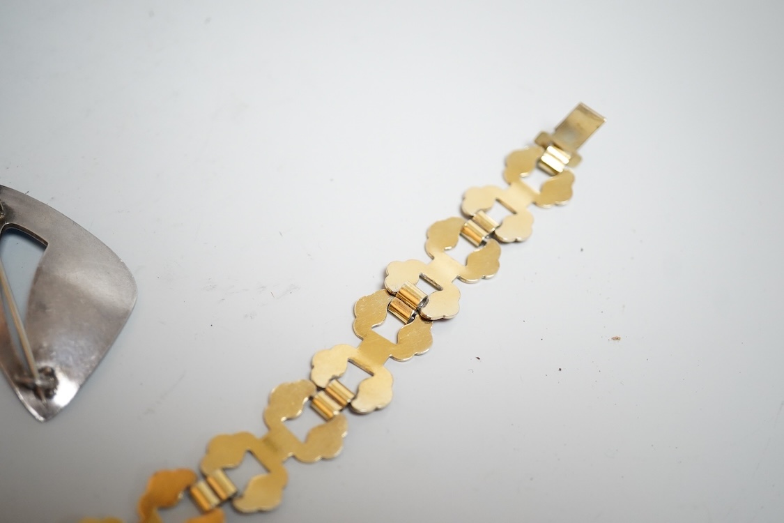 A pair of Norwegian gilt sterling and blue enamel ear clips by David Andersen, 31mm, together with one other Norwegian 925S and blue enamel free form brooch, 47mm and a gilt 925S and red enamel set necklace, 39.5cm.